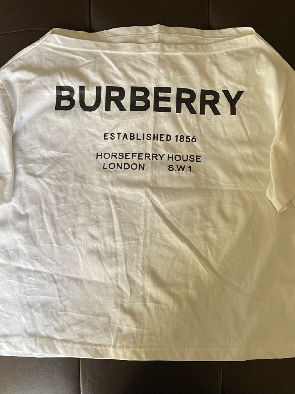 Burberry White Asymmetrical Tee with Bold Black Back Logo